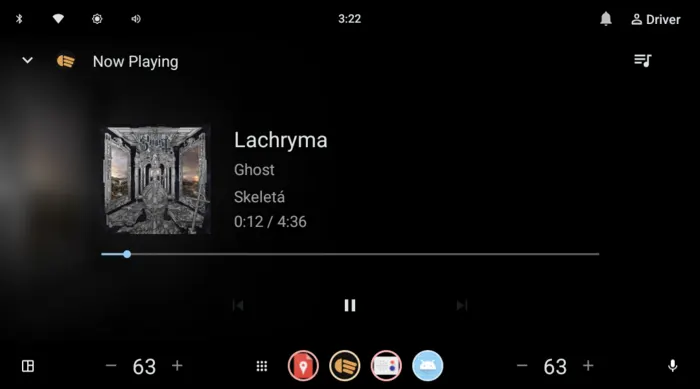 The generic Android Automotive now-playing screen showing Lachryma by Ghost, cover art on the left and track details on the right in landscape.