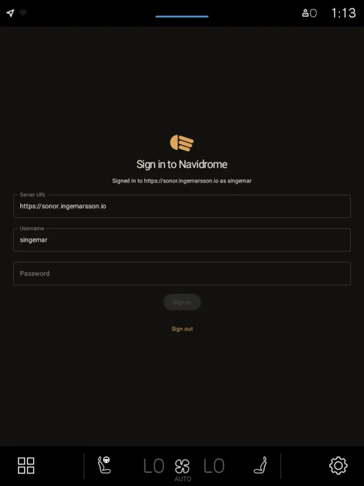 Lowbeam's sign-in screen on the XC40, with the amber headlight mark above Sign in to Navidrome, and server URL, username and password fields.